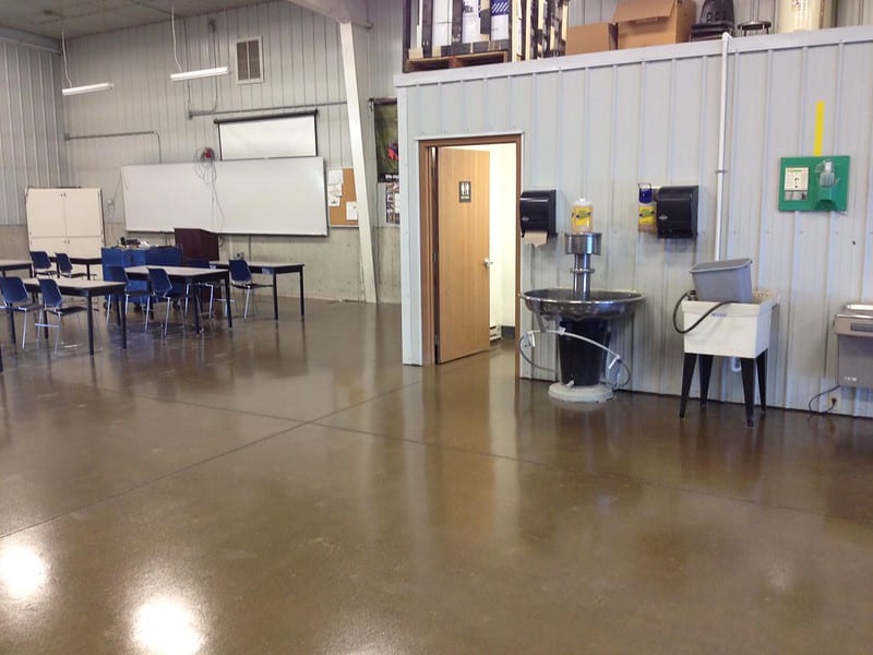 Image of a newly finished industrial concrete floor with a polished, glossy surface and sealant for durability and protection.