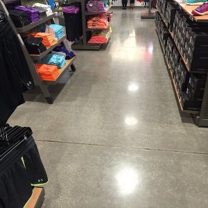 Commercial Polished Concrete Floor - A durable and versatile flooring option for commercial spaces, with a glossy and reflective finish.